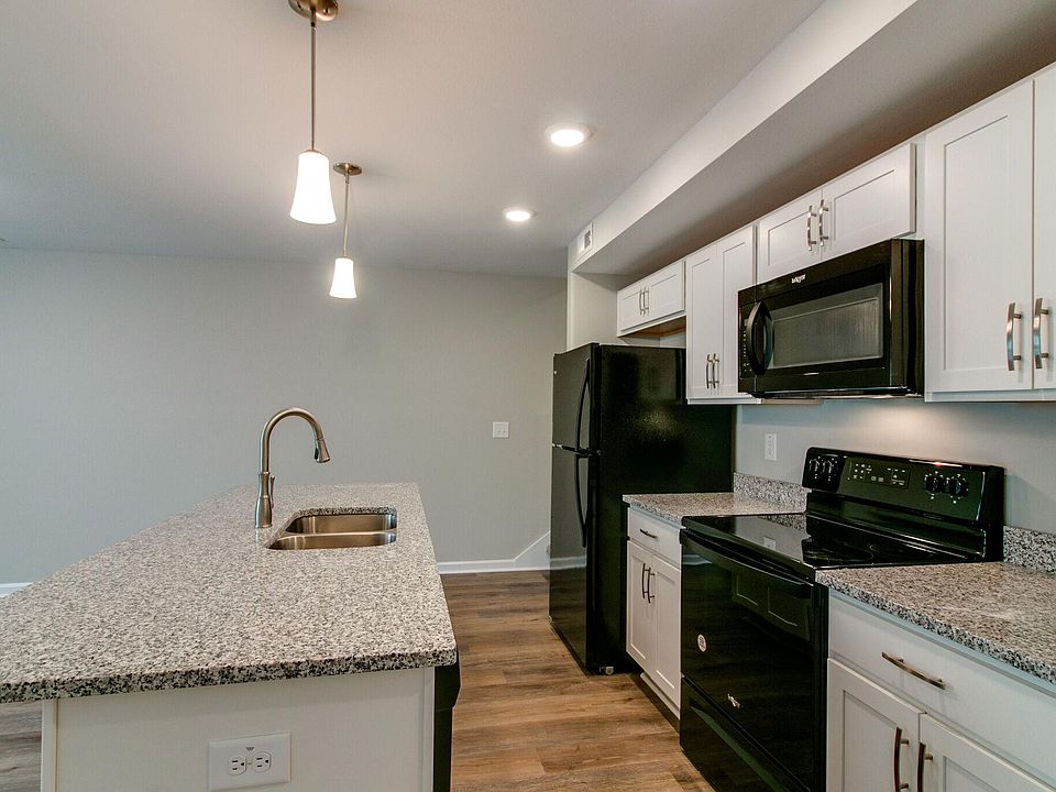Kitchen with All Appliances, Granite Countertops and Island with Overhang for additional seating.
