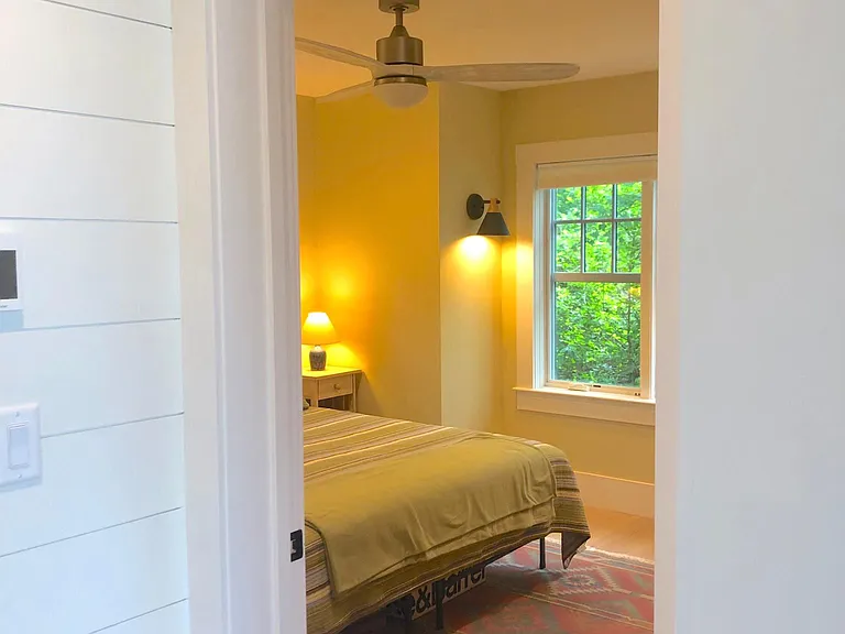 view into first floor bedroom from hallway