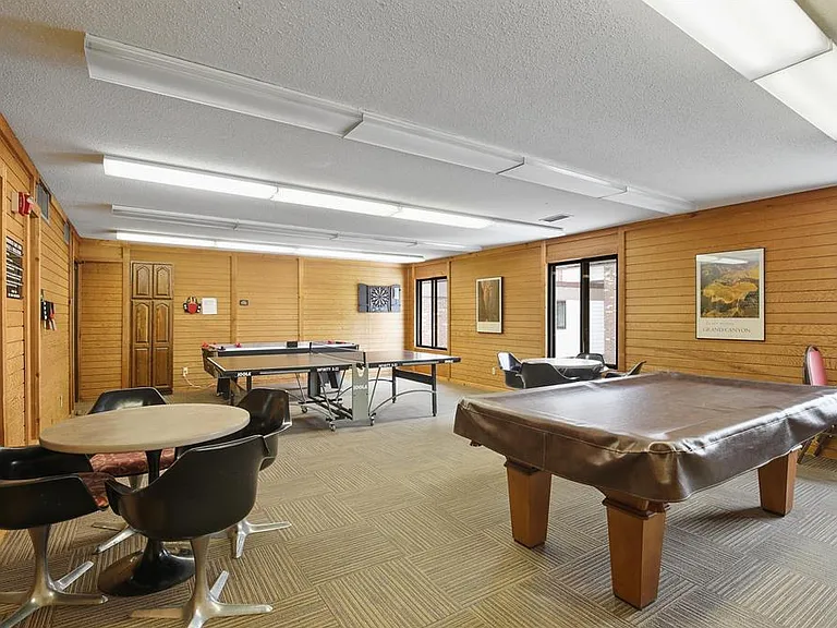 Game room with pool table and ping pong table