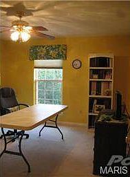 Bedroom four serves as the hobby room in this home.