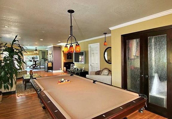 Alternate view of Large family room w/space for pool table & furniture.
