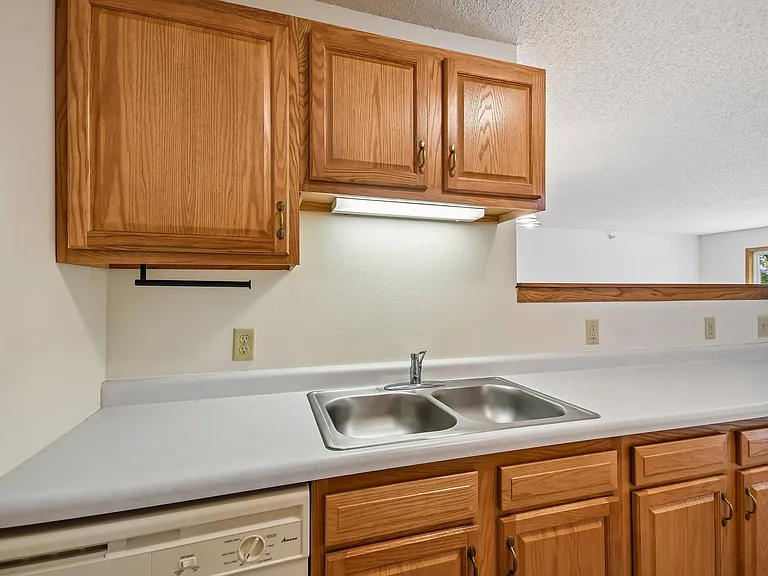 Elevate your culinary adventures in the modern kitchen at Mill Pond Apartments, featuring stylish cabinetry and ample counter space. Enjoy a space designed for both cooking and gathering. Schedule your tour today!