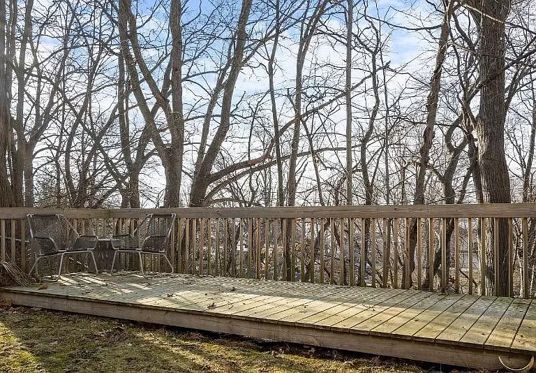 Third patio above the lake with fire pit. Not connected to the house.