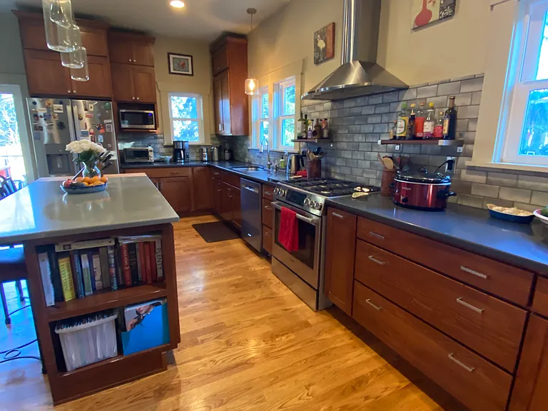 Opposite view of kitchen from dining area, so much storage in cabinets in addition to large pantry