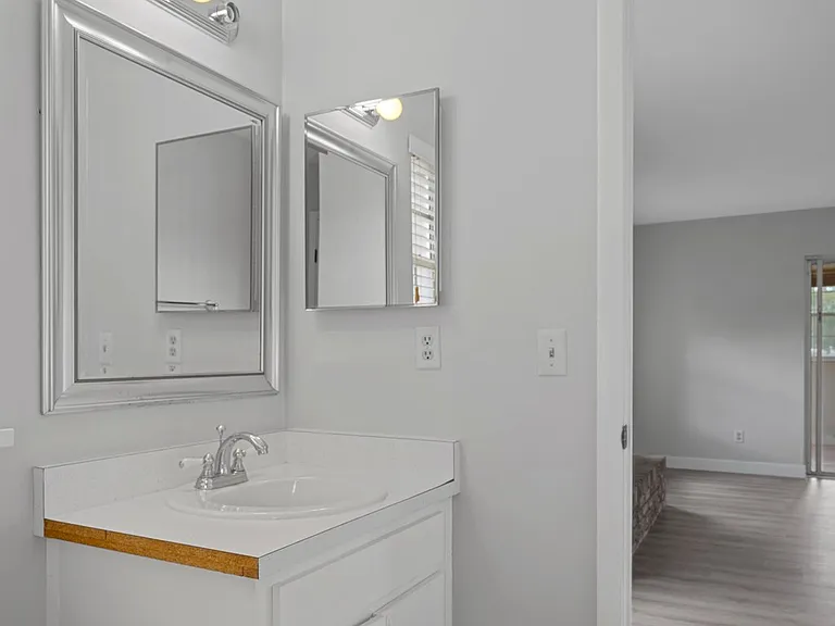 Full bath with entry to garage and family room