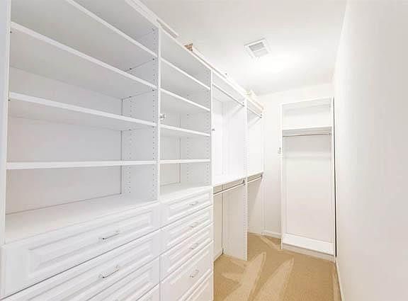 Huge Walk-In Closet with Organizers in Primary Bedroom