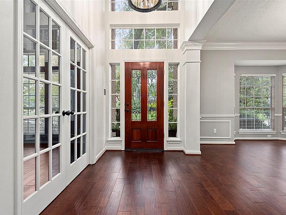 This view shows the main entrance with the study on the left and formal dining room on the right.