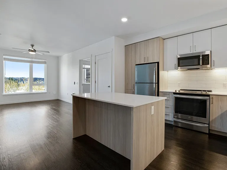 Large windows showcase premier views of the Cascades and lush forestry in select homes.