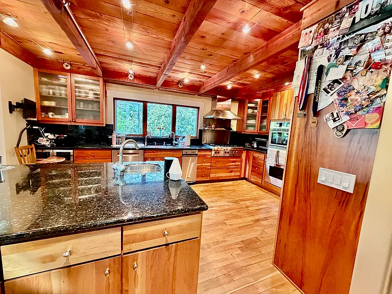 Kitchen equipped with large island.