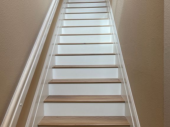Staircase to large open floor plan all on the same level.