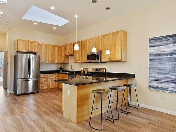 Kitchen has an added island in the center