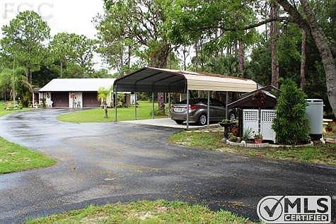 Carport , Garage, pump house and don't forget the paved driveway