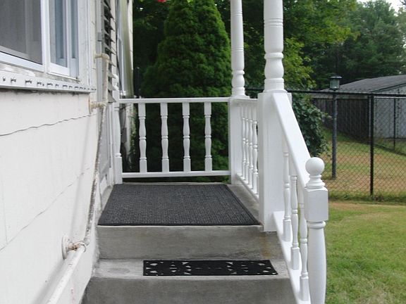 FARMHOUSE FRONT ENTRY SUMMERTIME FACING EAST