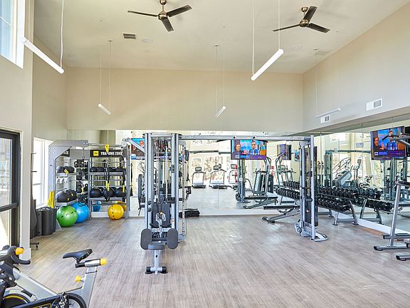 Well Equipped Fitness Room with Free Weights, Conditioning Equipment, Treadmills, Yoga Mats