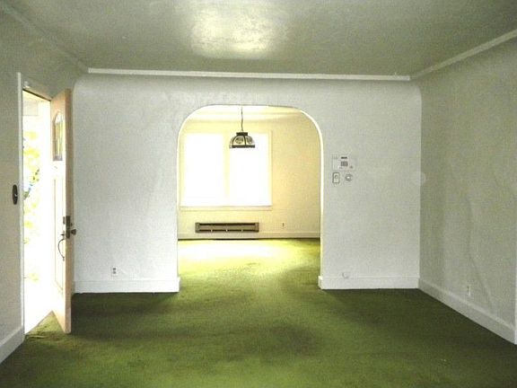 Large living room, hardwoods under carpet
