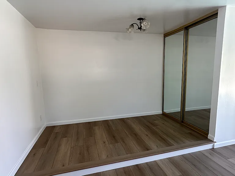 Step up open platform bedroom suite or private office with wall to wall closet.