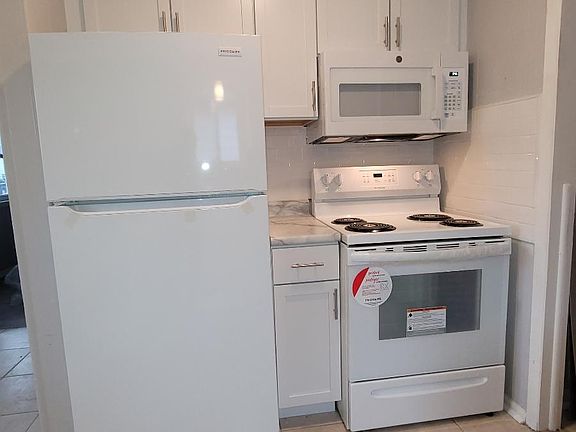 Brand new flooring, cabinetry, appliances, fixtures and paint