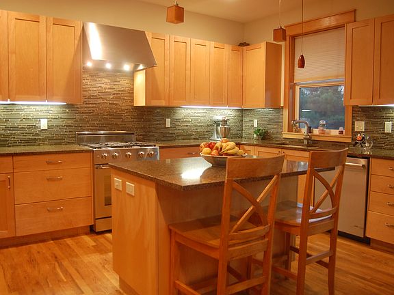 Large Kitchen with Custom Maple Cabinets and Quartz Countertops.