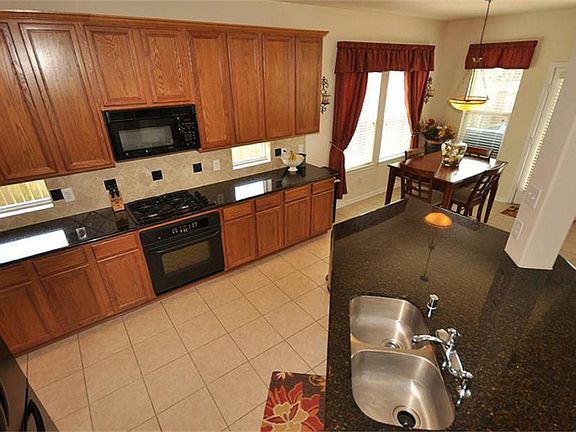 The chef will feel right at home in this kitchen that includes the granite countertops, stainless st