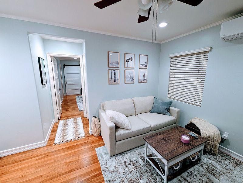 Living room with convertible coffee table/desk