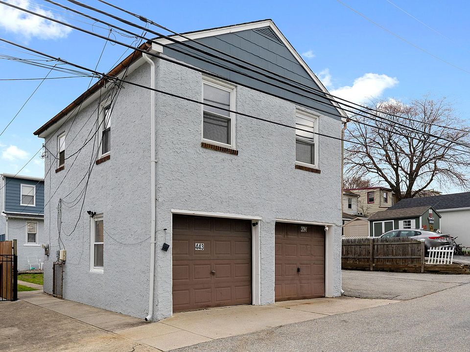 Outside of the unit - entrance is on the left of the garage