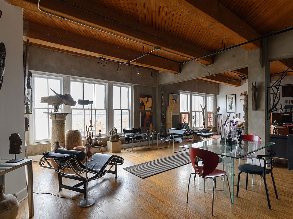 This is another of the same floor plan with light floors. Available loft has dark wood floors.