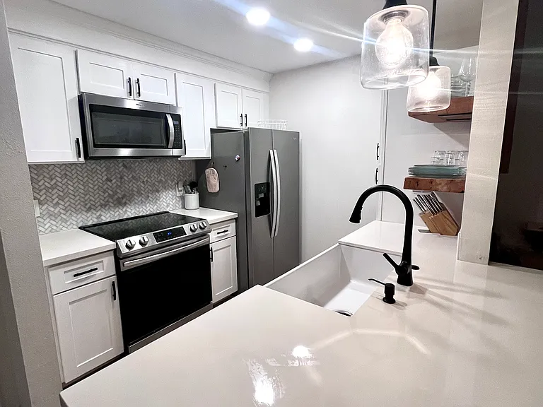 Kitchen: Microwave and dishwater are 5 years old. Oven is 3 years old and fridge is 1.5 years old.