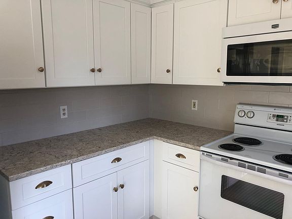 Newly updated cabinets, countertops and backsplash.