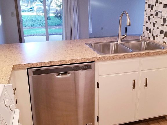 Updated kitchen looking into dining nook and covered patio