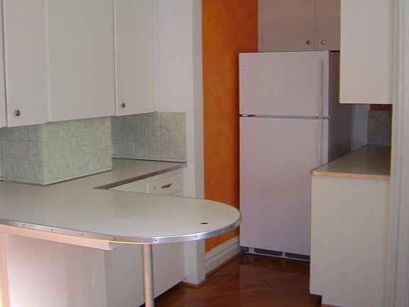 kitchen work area and refrigerator