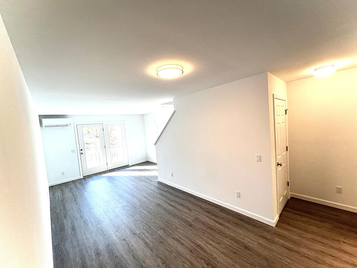 Entry from basement to living room - 10 Village Way