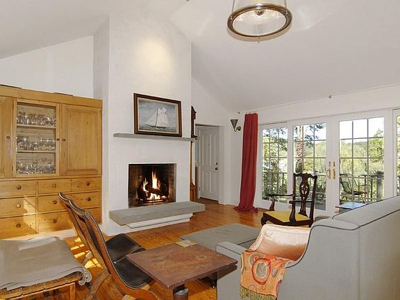 Livng room with fireplace and French
        doors