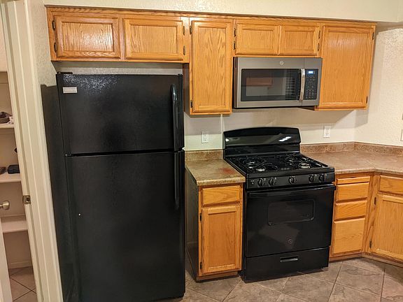 Refrigerator, range, and microwave included