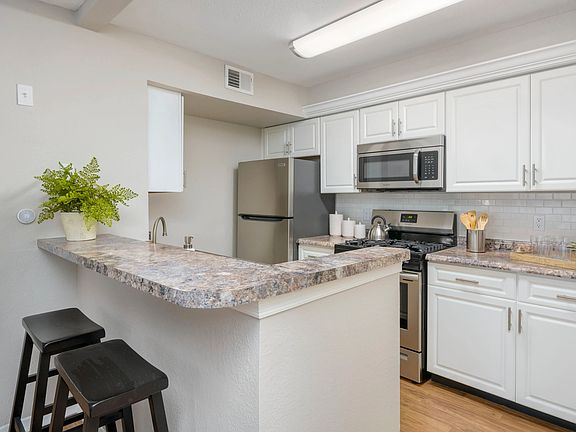 Relish gleaming kitchens with subway tile backsplash and white cabinetry for a modern touch.