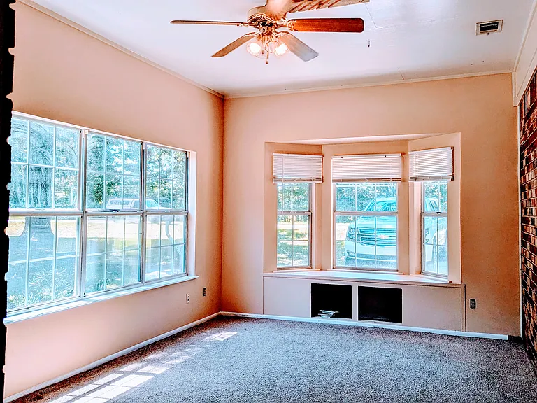 The family feels more like a sunroom. It is very open and bright. The living room is in the front entry and quite.