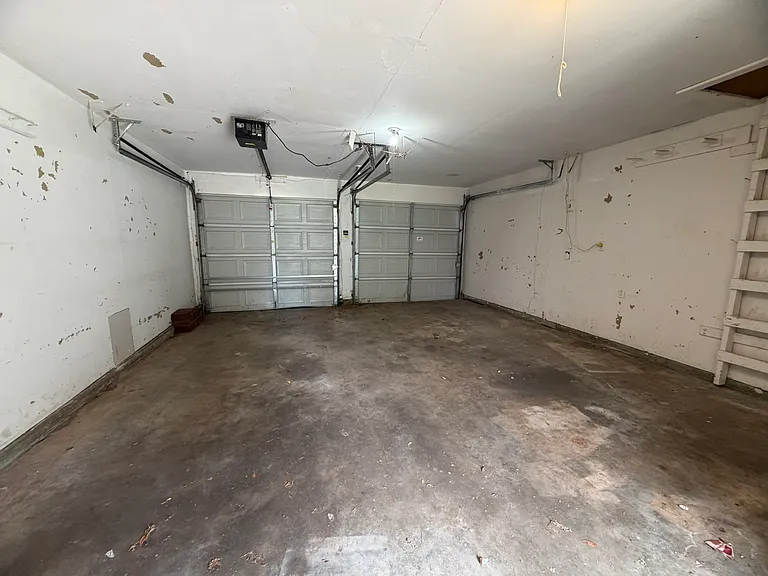 Two Car Garage Washer and dryer hook ups in garage.