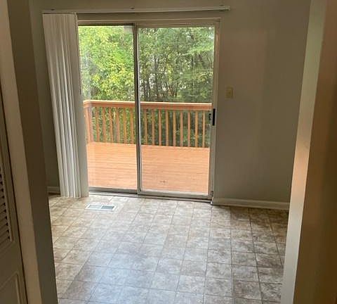 kitchen sliding door to large wood deck