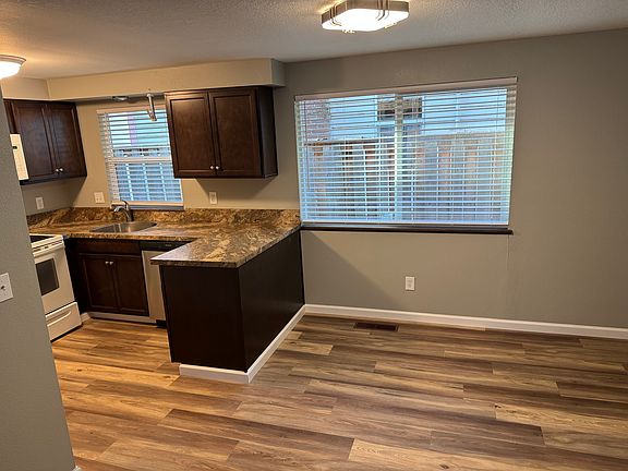 Kitchen showing open dining room