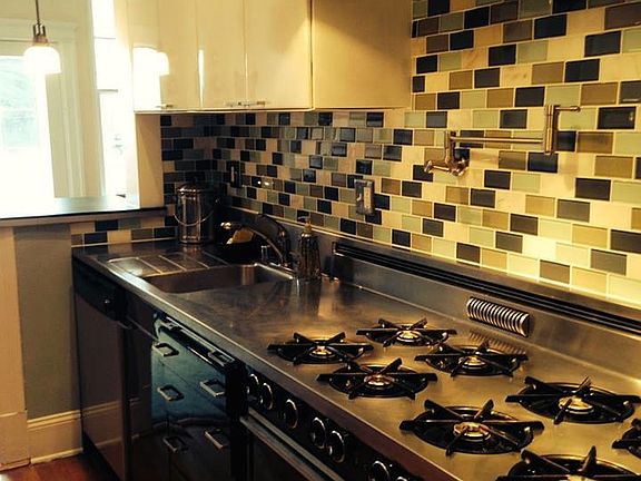 Renovated kitchen - stainless counters and appliances