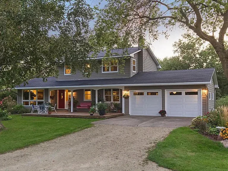 Front of house and 2-car garage and driveway