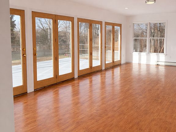 Living room with French doors leading out to oversized deck 
13'6" x 29'6"