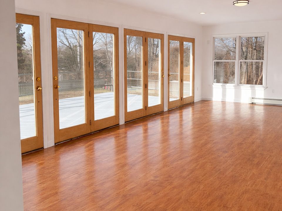 Living room with French doors leading out to oversized deck 
13'6" x 29'6"