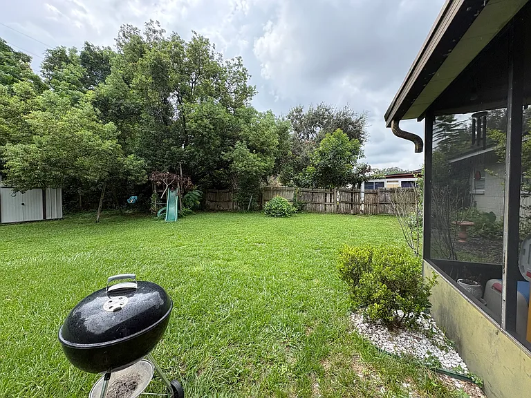 Large fenced backyard perfect for relaxing and entertaining