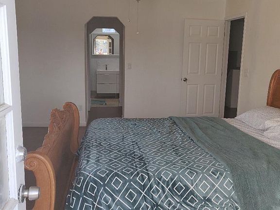MASTERBEDROOM WITH with office table and chair. TWO Walk-in CLOSETS AND PRIVATE BATHROOM.