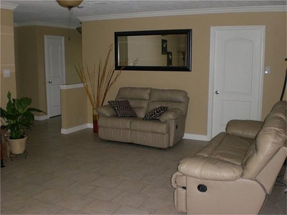 Large Living area with tiled flooring
