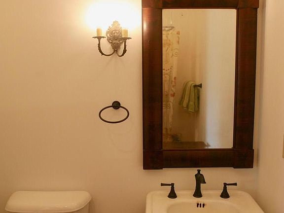 Downstairs bathroom. This bathroom has a claw foot tub (not pictured) with a shower.