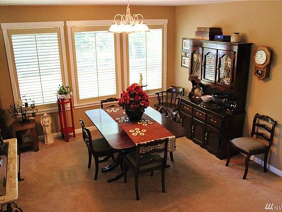 Home flows into formal dining space with more fantastic windows.  