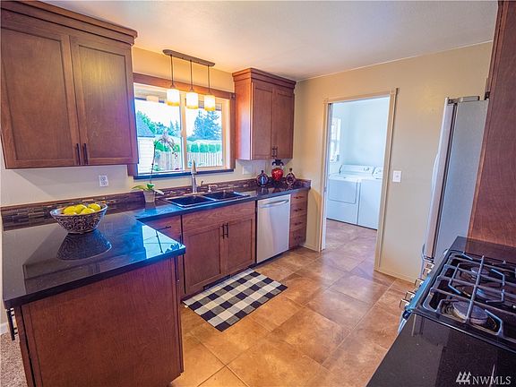 Tile floor and granite countertops with new cabinets