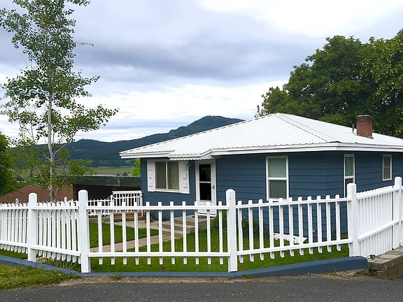 front yard/white fence