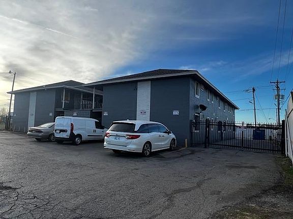 Front of the building with gate to go to the back parking lot